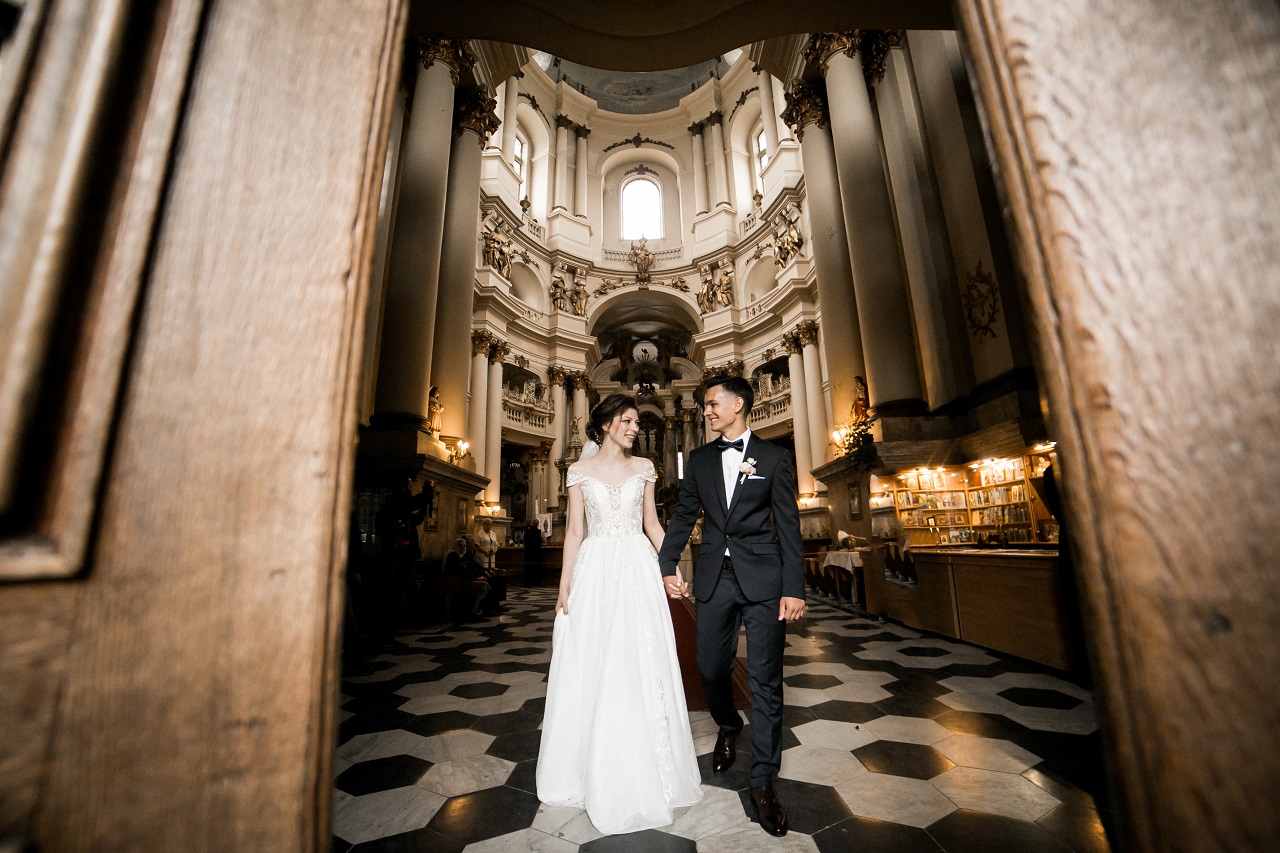 A couple who just wed stepping out of the church together