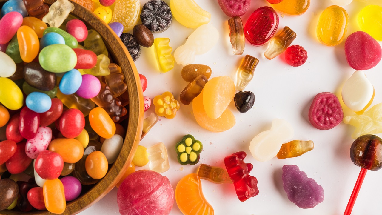 An overflowing bowl of different types of candy