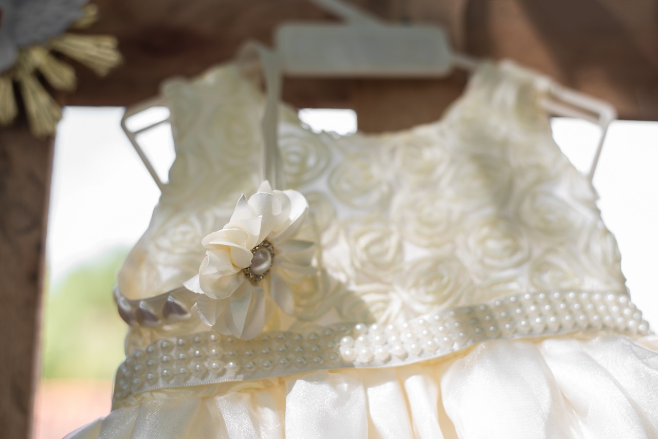 Close up of a baby's baptismal dress