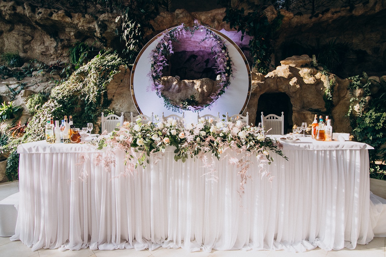 A bride and groom's table at a wedding reception