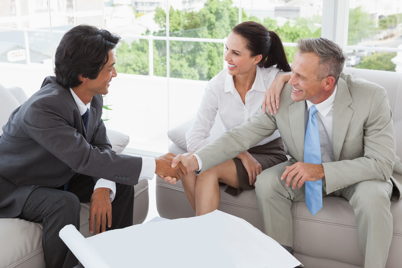 A businessman shaking hands with a foreign investor