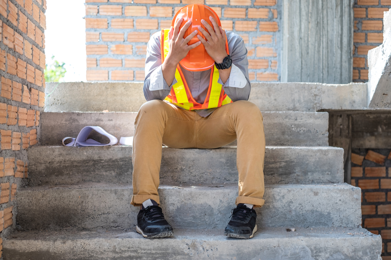 A stressed construction worker