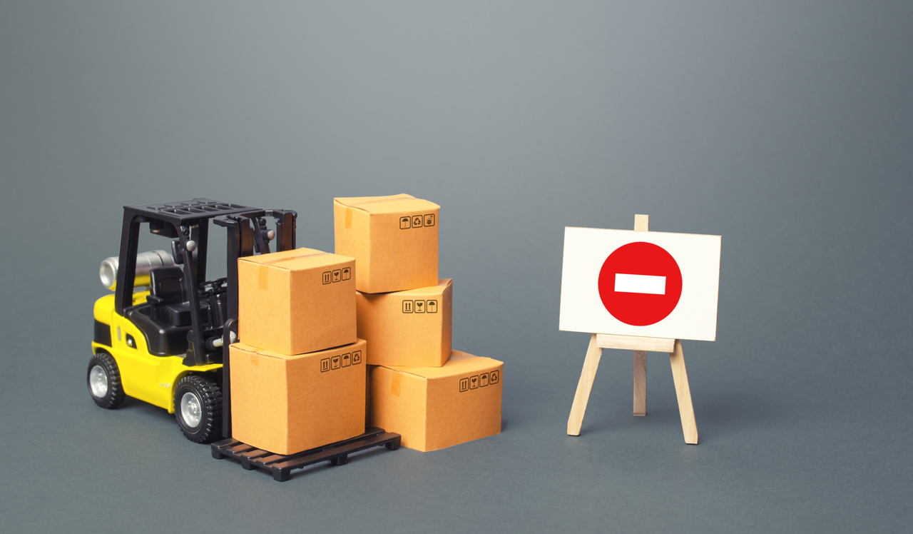 A forklift with a no entry sign beside it