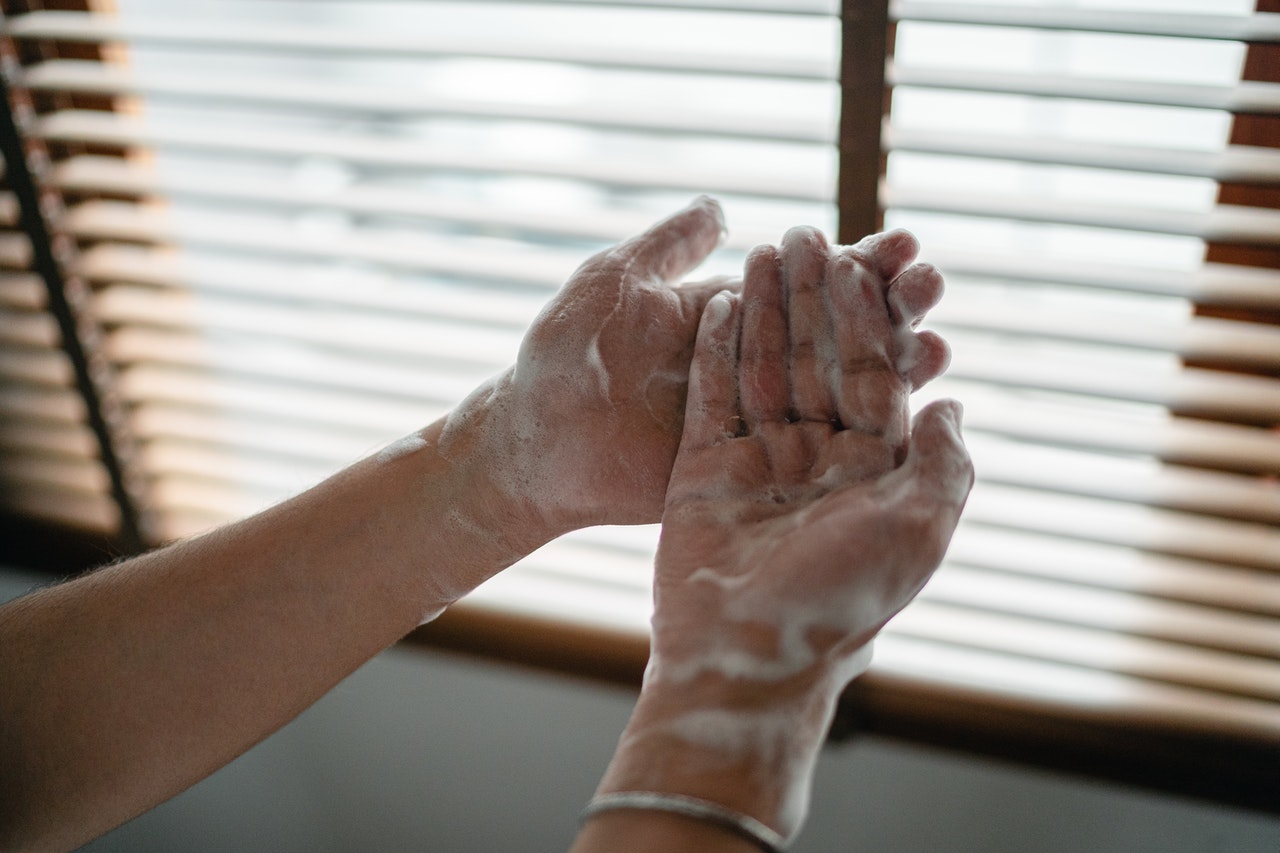 A person thoroughly washing their hands